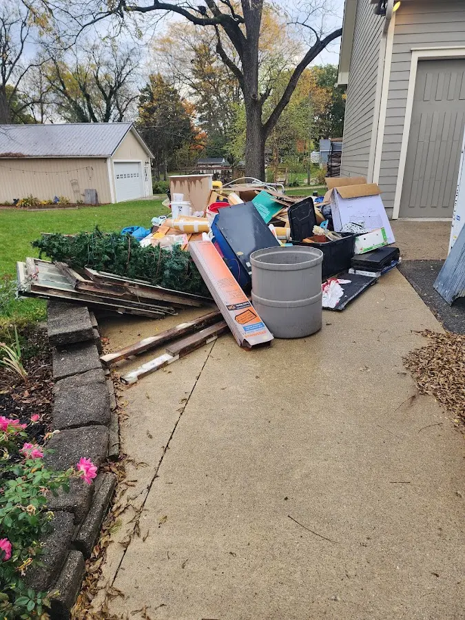 Dumpster being loaded with debris for Commercial Dumpster Rental in Braidwood